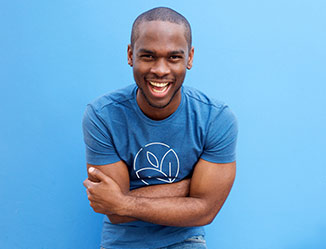 Happy person showing off a t-shirt with a custom logo
