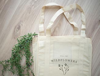 Custom tote bag with wildflowers logo