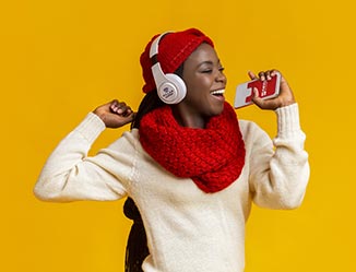 Happy person wearing headphones with logo